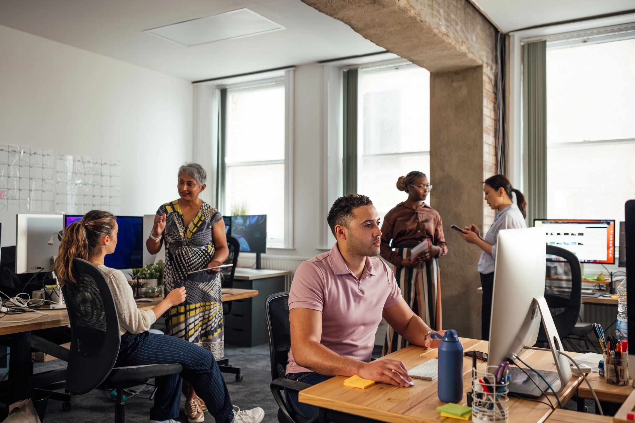 Professional office team collaborating in a modern workspace