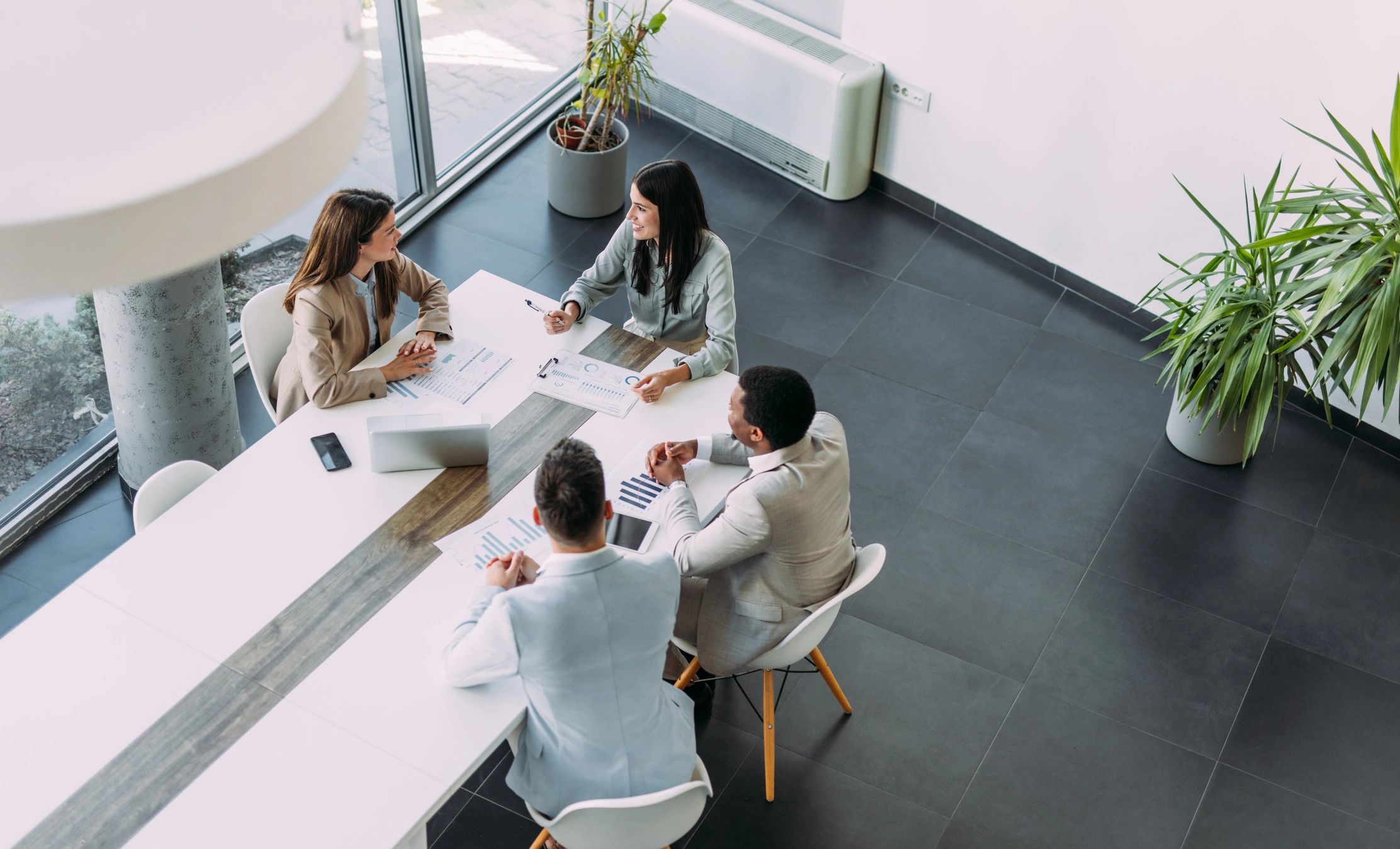 Business professionals meeting around a conference table