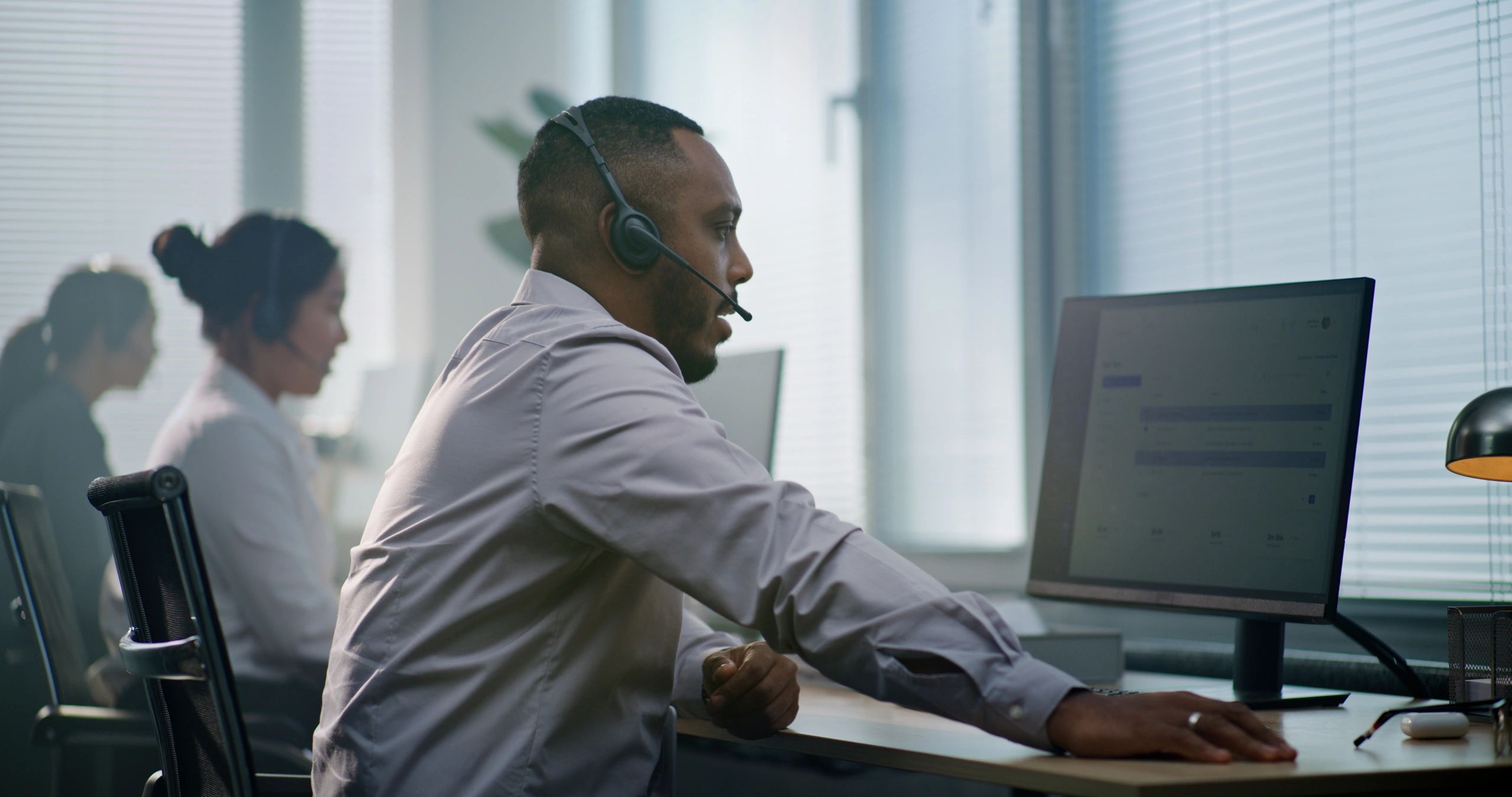 Administrative support professional working at a computer