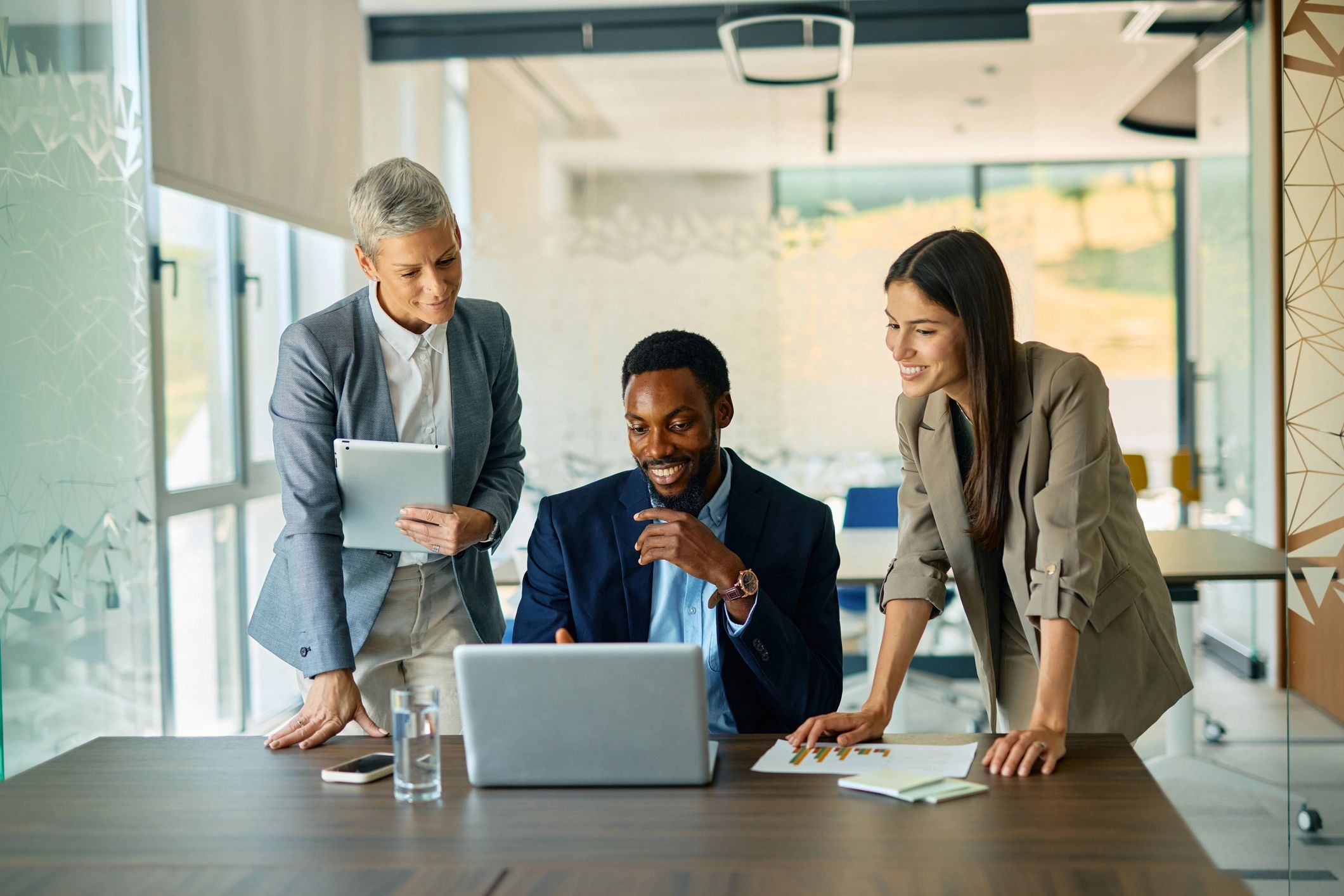 Business professionals collaborating on operations planning in a modern office